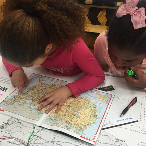 youth exploring map